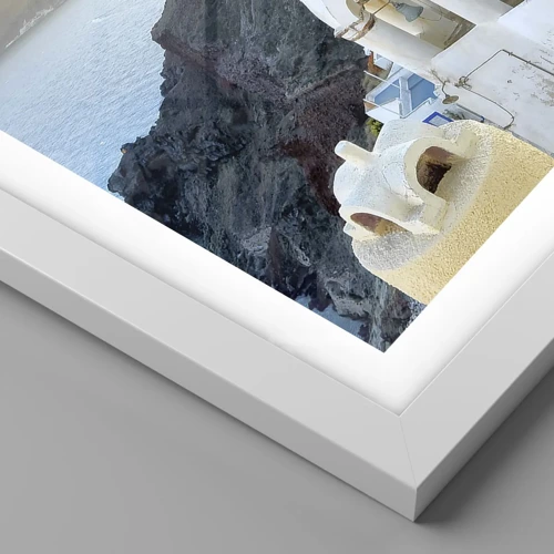Affiche dans un cadre blanc - Poster - Santorin - blotti contre les rochers - 40x40 cm