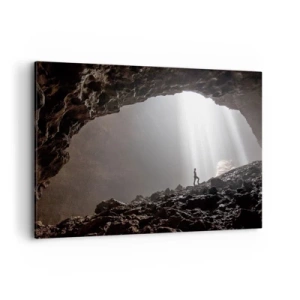 Impression sur toile - Image sur toile - Une figure dans une grotte éclairée par des rayons de lumière - 100x70cm - Grotte lumineuse - Décoration murale moderne pour le salon et la chambre ARTTOR