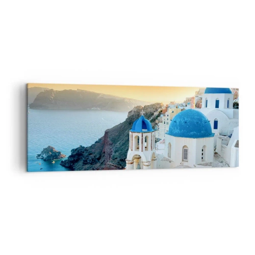 Impression sur toile - Image sur toile - Vue de Santorin avec des bâtiments blancs et une mer bleue - 140x50cm - Santorin - blotti contre les rochers - Décoration murale moderne pour le salon et la chambre ARTTOR