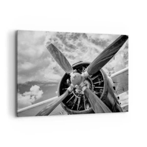 Impression sur toile - Image sur toile - Une photo en noir et blanc d'une hélice d'avion contre un ciel dynamique. - 100x70cm - Dompteur de ciel - Décoration murale moderne pour le salon et la chambre ARTTOR