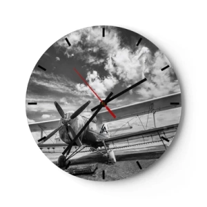 Horloge murale - Pendule murale - Une photo en noir et blanc d'un avion avec des nuages en arrière-plan. - 30x30cm - Je suis impatient! - Décoration murale moderne pour le salon, la cuisine et la chambre ARTTOR