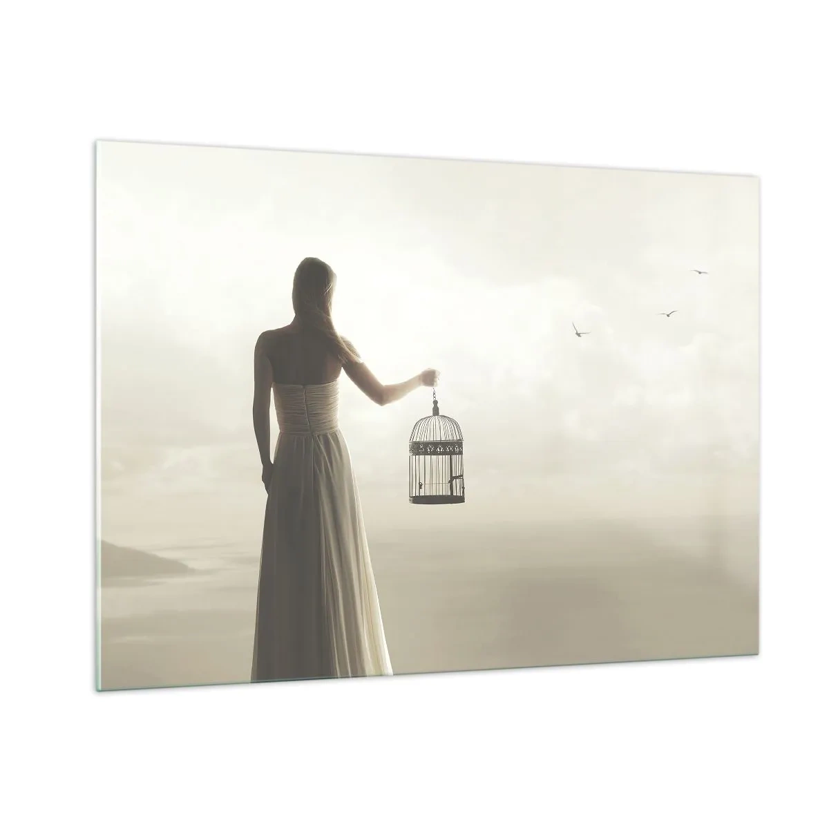 Impression sur verre - Image sur verre - Une femme avec une cage regardant les oiseaux s'envoler dans le ciel - 100x70cm - Soi libre - Décoration murale moderne pour le salon et la chambre ARTTOR