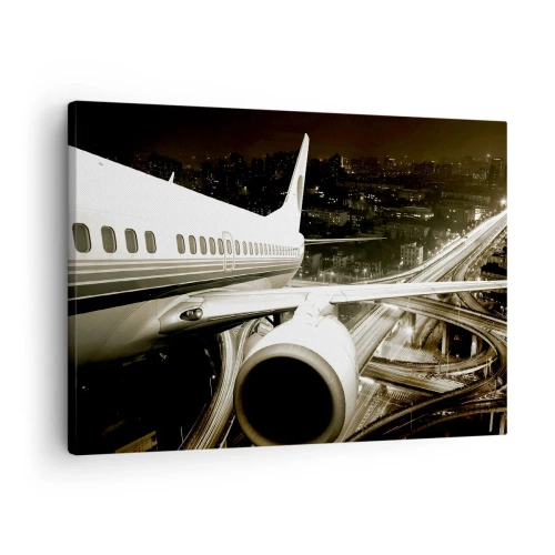 Impression sur toile - Image sur toile - Un avion au-dessus d'une ville nocturne avec des autoroutes illuminées - 70x50cm - Vole dans la nuit - Décoration murale moderne pour le salon et la chambre ARTTOR