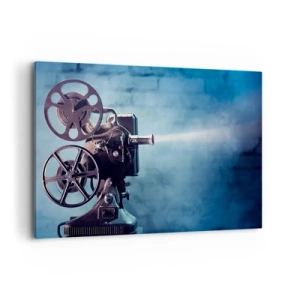 Impression sur toile - Image sur toile - Un vieux projecteur de cinéma projetant de la lumière sur un fond bleu - 120x80cm - Dans un vieux cinéma - Décoration murale moderne pour le salon et la chambre ARTTOR