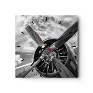 Horloge murale - Pendule murale - Une photo en noir et blanc d'une hélice d'avion contre un ciel dynamique. - 30x30cm - Dompteur de ciel - Décoration murale moderne pour le salon et la chambre ARTTOR
