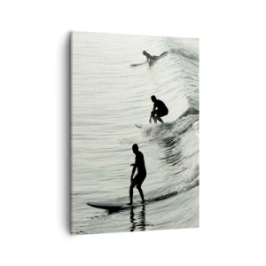 Impression sur toile - Image sur toile - Surfeurs sur les vagues dans une photo monochrome - 50x70cm - A la rencontre de la vague - Décoration murale moderne pour le salon et la chambre ARTTOR