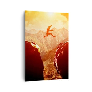 Impression sur toile - Image sur toile - Une silhouette sautant entre des rochers avec des montagnes en arrière-plan - 70x100cm - Dépassement des limites - Décoration murale moderne pour le salon et la chambre ARTTOR