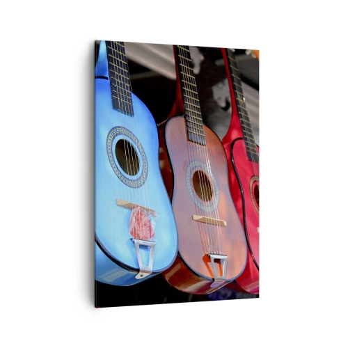 Impression sur toile - Image sur toile - Des guitares acoustiques colorées sont accrochées en rangée dans une exposition - 70x100cm - Ambiance latine - Décoration murale moderne pour le salon et la chambre ARTTOR