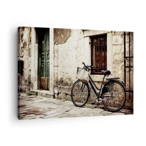 Impression sur toile - Image sur toile - Un vélo contre un mur de pierre avec une fenêtre et une porte de style rétro - 70x50cm - Retour au passé - Décoration murale moderne pour le salon et la chambre ARTTOR