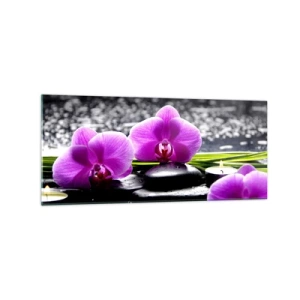Impression sur verre - Image sur verre - Orchidées violettes sur fond de pierres et de bougies dans un cadre relaxant - 120x50cm - Se noyer dans la paix et la tranquillité - Décoration murale moderne pour le salon et la chambre ARTTOR
