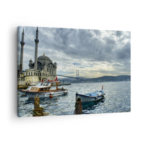 Impression sur toile - Image sur toile - Un bâtiment historique sur l'eau avec des bateaux et un pont en arrière-plan - 70x50cm - Aux confins des mondes - Décoration murale moderne pour le salon et la chambre ARTTOR