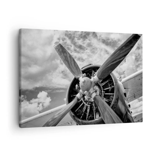 Impression sur toile - Image sur toile - Une photo en noir et blanc d'une hélice d'avion contre un ciel dynamique. - 70x50cm - Dompteur de ciel - Décoration murale moderne pour le salon et la chambre ARTTOR