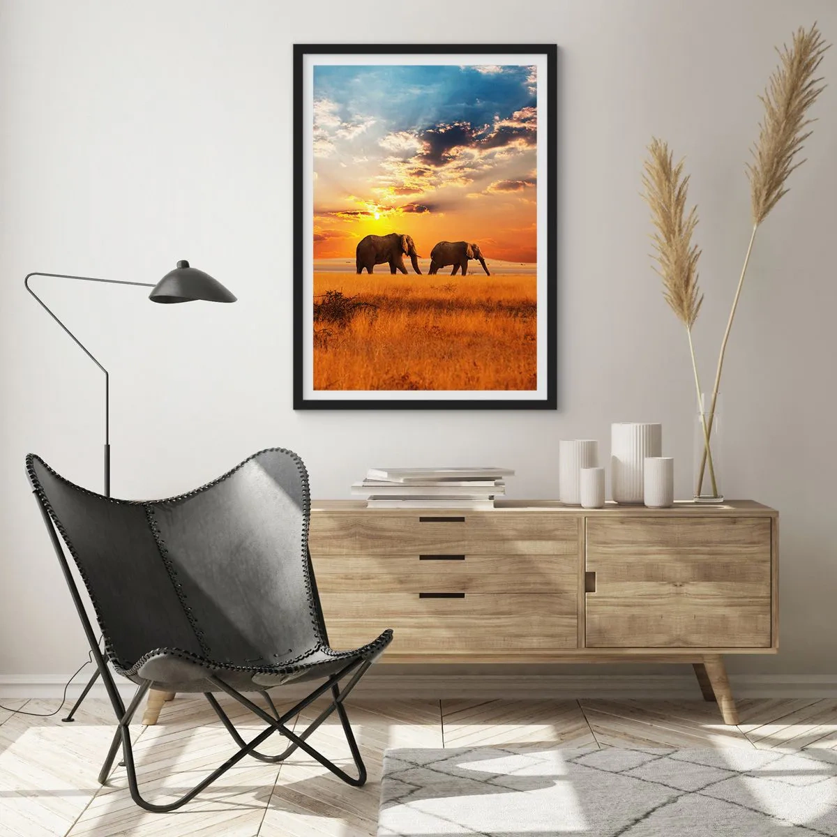 Affiche dans un cadre noir - Poster - Des éléphants marchant dans la lueur du soleil couchant - 50x70cm - Déambulation familliale - Décoration murale moderne pour le salon et la chambre ARTTOR