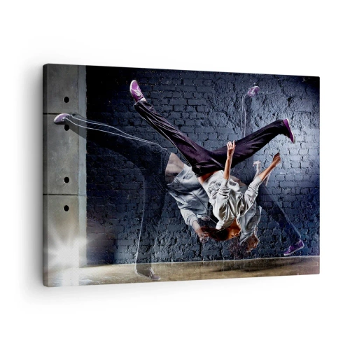 Impression sur toile - Image sur toile - Un danseur effectuant un saut dynamique contre un mur de briques - 70x50cm - Étoile de la rue - Décoration murale moderne pour le salon et la chambre ARTTOR