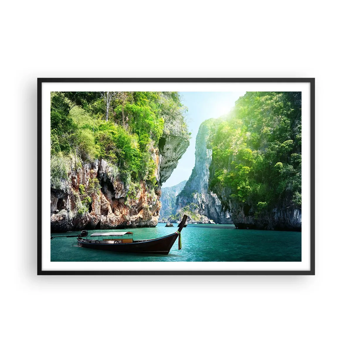 Affiche dans un cadre noir - Poster - Un bateau traditionnel sur fond de falaises tropicales et d'eaux turquoises - 100x70cm - Une invitation à un voyage exotique - Décoration murale moderne pour le salon et la chambre ARTTOR