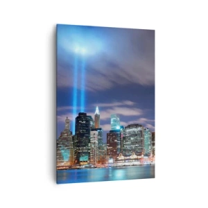 Impression sur toile - Image sur toile - Panorama nocturne de la ville avec deux faisceaux lumineux dans le ciel - 70x100cm - Atteindre le ciel avec la lumière - Décoration murale moderne pour le salon et la chambre ARTTOR