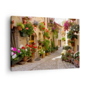 Impression sur toile - Image sur toile - Une rue avec des pots de fleurs et des murs de pierre - 70x50cm - Une inondation de fleurs  - Décoration murale moderne pour le salon et la chambre ARTTOR