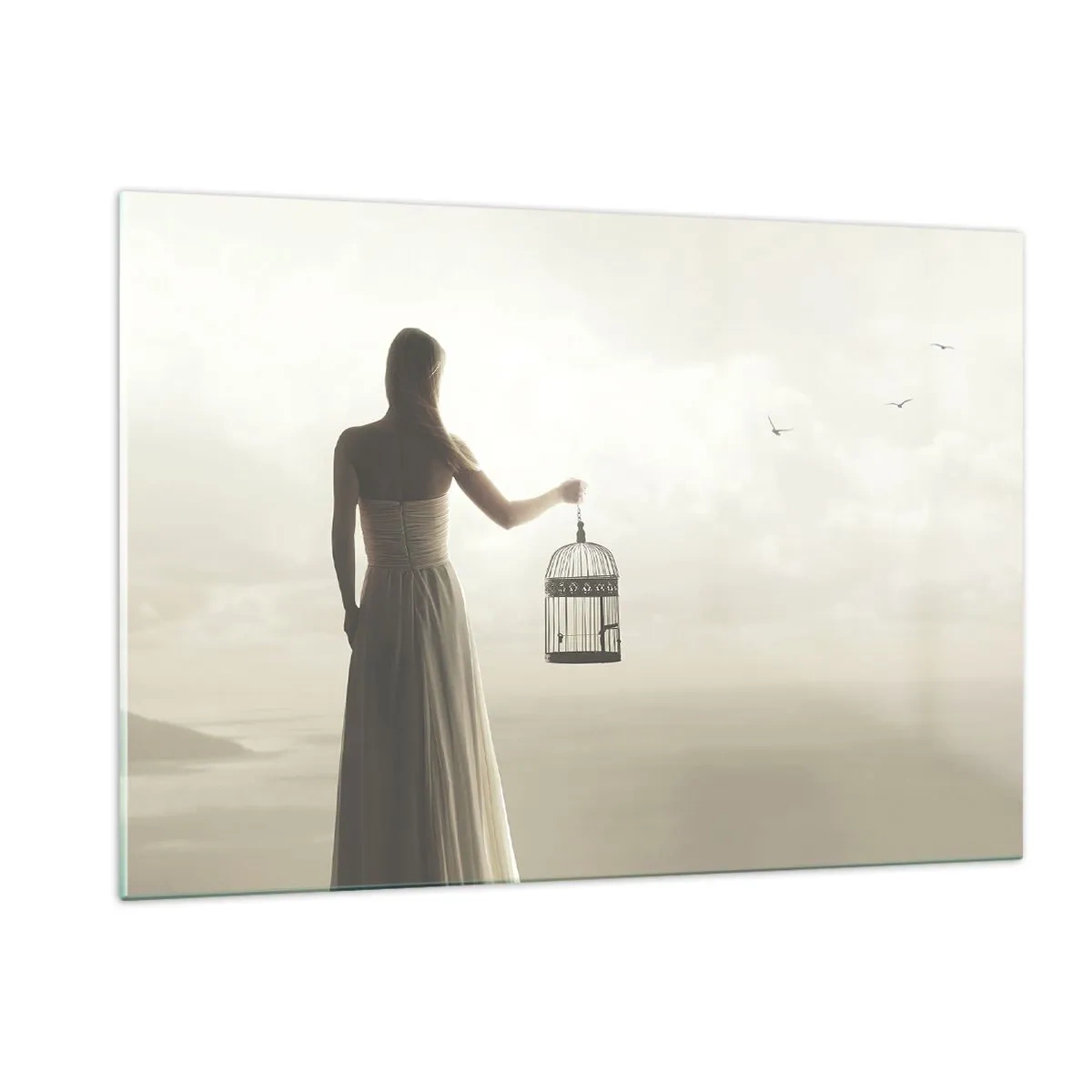 Impression sur verre - Image sur verre - Une femme avec une cage regardant les oiseaux s'envoler dans le ciel - 120x80cm - Soi libre - Décoration murale moderne pour le salon et la chambre ARTTOR