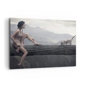 Impression sur toile - Image sur toile - Une femme et un chat sur un tronc d'arbre sous la pluie avec vue sur les montagnes. - 100x70cm - Des sommets de beauté - Décoration murale moderne pour le salon et la chambre ARTTOR