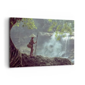 Impression sur toile - Image sur toile - Une figure avec une lance près d'une cascade dans une forêt tropicale - 100x70cm - Lier d'amitié avec la nature - Décoration murale moderne pour le salon et la chambre ARTTOR