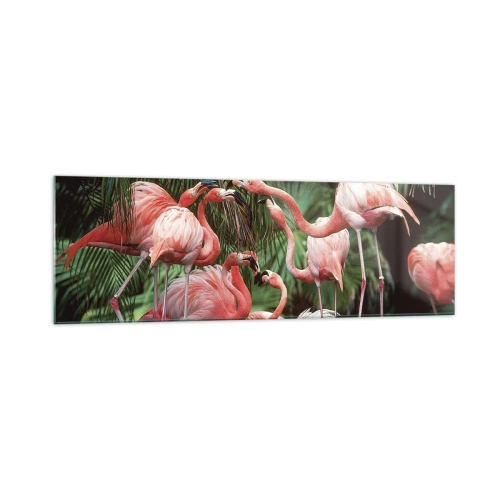 Impression sur verre - Image sur verre - Un groupe de flamants roses dans un cadre tropical entouré de palmiers - 160x50cm - Potins d'après-midi - Décoration murale moderne pour le salon et la chambre ARTTOR