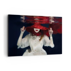 Impression sur toile - Image sur toile - Une femme avec un chapeau rouge immergée dans l'eau - 100x70cm - Femme mystérieuse - Décoration murale moderne pour le salon et la chambre ARTTOR