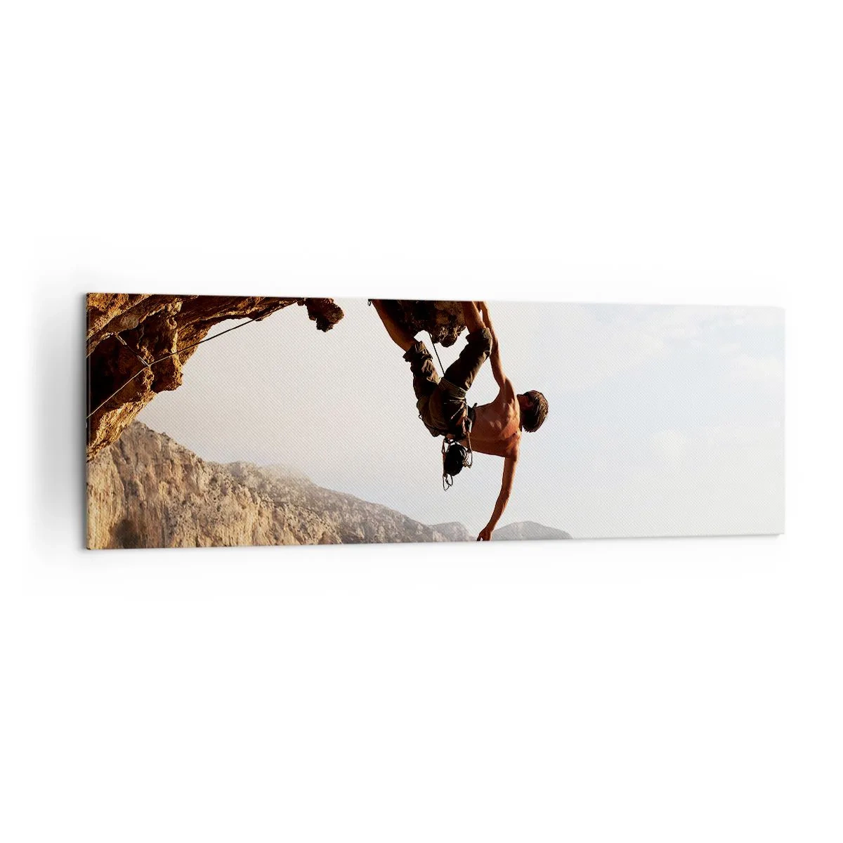 Impression sur toile - Image sur toile - Un grimpeur sur une falaise abrupte dans les montagnes au soleil - 160x50cm - Le monde rétréci dans une main sur une coupe de rocher - Décoration murale moderne pour le salon et la chambre ARTTOR