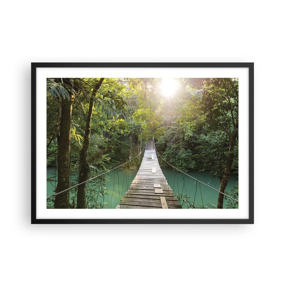 Affiche dans un cadre noir - Poster - Un pont suspendu dans une forêt tropicale illuminée par la lumière du soleil. - 70x50cm - De l'eau azur à la forêt azur - Décoration murale moderne pour le salon et la chambre ARTTOR