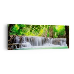 Impression sur toile - Image sur toile - Une cascade verte entourée d'une végétation tropicale dense - 140x50cm - Une cascade de vert - Décoration murale moderne pour le salon et la chambre ARTTOR