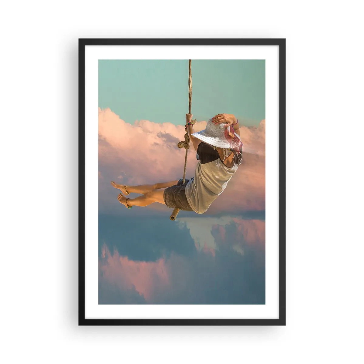 Affiche dans un cadre noir - Poster - Une femme sur une balançoire parmi des nuages pastel - 50x70cm - S'amuser dans les nuages - Décoration murale moderne pour le salon et la chambre ARTTOR