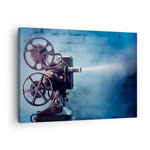 Impression sur toile - Image sur toile - Un vieux projecteur de cinéma projetant de la lumière sur un fond bleu - 70x50cm - Dans un vieux cinéma - Décoration murale moderne pour le salon et la chambre ARTTOR