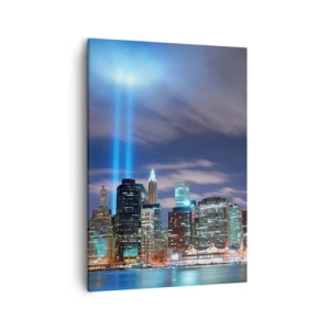 Impression sur toile - Image sur toile - Panorama nocturne de la ville avec deux faisceaux lumineux dans le ciel - 50x70cm - Atteindre le ciel avec la lumière - Décoration murale moderne pour le salon et la chambre ARTTOR