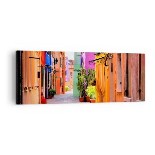 Impression sur toile - Image sur toile - Une rue colorée avec des immeubles aux tons clairs - 140x50cm - Allée arc-en-ciel - Décoration murale moderne pour le salon et la chambre ARTTOR