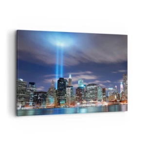 Impression sur toile - Image sur toile - Panorama nocturne de la ville avec deux faisceaux lumineux dans le ciel - 100x70cm - Atteindre le ciel avec la lumière - Décoration murale moderne pour le salon et la chambre ARTTOR