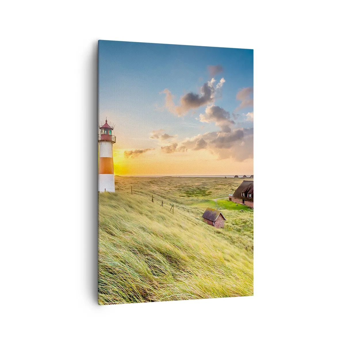 Impression sur toile - Image sur toile - Un phare avec des prairies et des maisons au soleil en arrière-plan - 80x120cm - Entre les vagues - Décoration murale moderne pour le salon et la chambre ARTTOR
