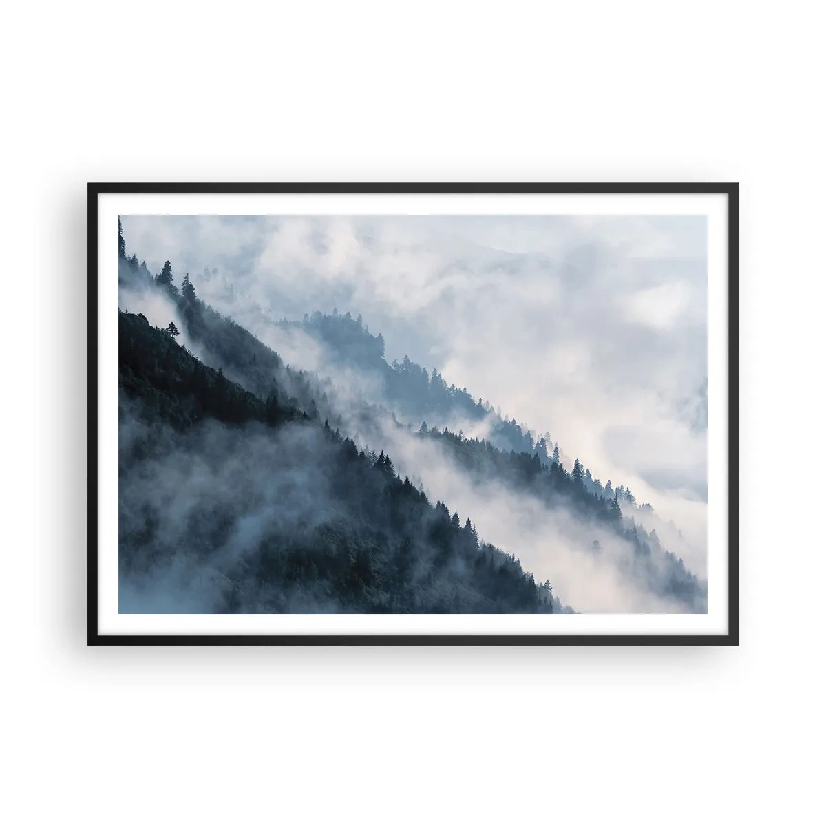 Affiche dans un cadre noir - Poster - Le brouillard plane sur les flancs boisés des montagnes dans un paysage mystérieux - 100x70cm - Mysticisme des montagnes - Décoration murale moderne pour le salon et la chambre ARTTOR