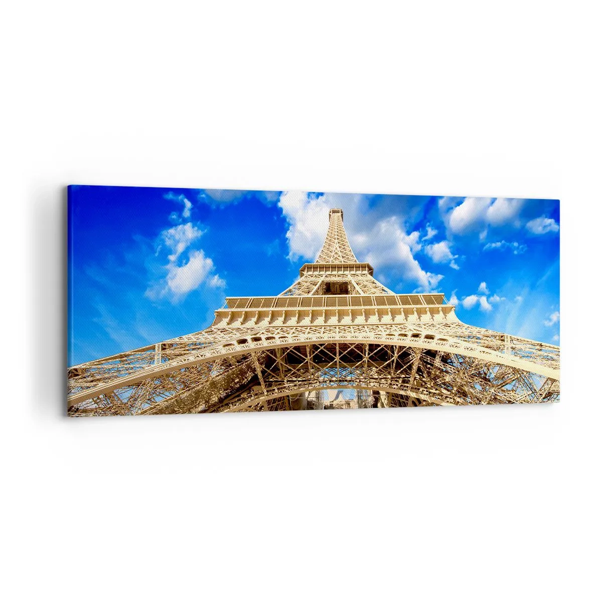 Impression sur toile - Image sur toile - La Tour Eiffel vue d'en bas contre un ciel bleu - 120x50cm - Atteindre le ciel et les nuages - Décoration murale moderne pour le salon et la chambre ARTTOR